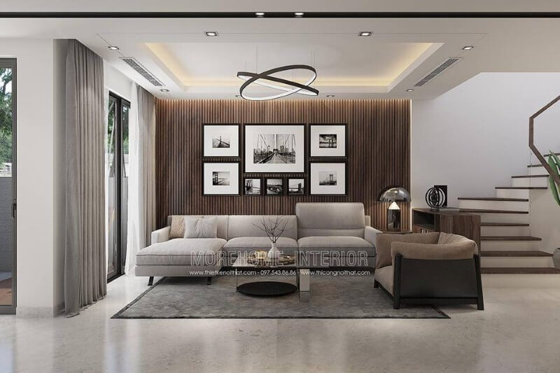 Thiết kế tường phòng khách đẹp độc đáo với gỗ ốp tường kết hợp tranh đen trắng địa danh nổi tiếng. Thiết kế nội thất phòng khách biệt thự